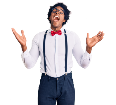 Handsome african american man with afro hair wearing hipster elegant look celebrating mad and crazy for success with arms raised and closed eyes screaming excited. winner concept