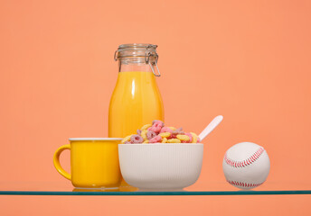 Breakfast cereal, fresh orange juice and baseball. Sports diet.