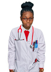 Young african american woman wearing doctor uniform and stethoscope skeptic and nervous, frowning upset because of problem. negative person.