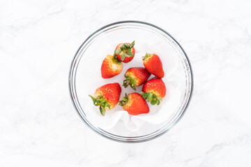 Washed and Dried Strawberries Neatly Stored in a Glass Bowl
