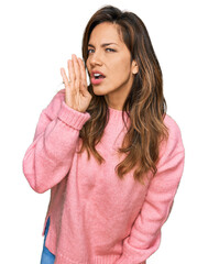 Fototapeta premium Young hispanic woman wearing casual clothes hand on mouth telling secret rumor, whispering malicious talk conversation