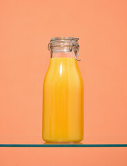 Orange juice in a glass bottle. Summer and nutrition.