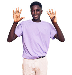 Young african american man wearing casual clothes showing and pointing up with fingers number nine...