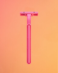 Pink razor. Shaving and skin care.