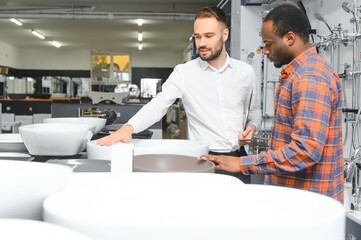 Obraz premium African customer with salesman in store for the house