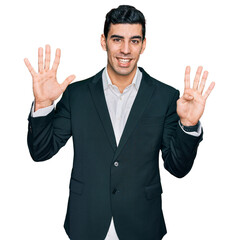 Handsome hispanic man wearing business clothes showing and pointing up with fingers number nine...