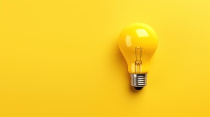  a yellow light bulb sitting on top of a yellow wall next to a pair of scissors and a pair of scissors.