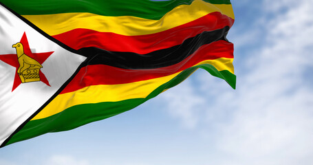 Close-up view of the Zimbabwe national flag waving in the wind