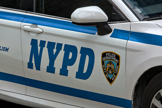 Police logo on the side of NYPD police car cruiser