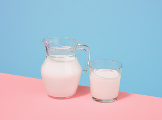 Fresh milk in a glass jug and glass. Healthy product for breakfast.