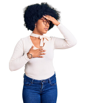 Young african american girl wearing casual clothes and glasses touching forehead for illness and fever, flu and cold, virus sick