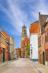 Brugge city historical center, empty narrow street, paving stone road in Bruges old town, St....