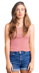 Beautiful caucasian young woman wearing casual clothes depressed and worry for distress, crying angry and afraid. sad expression.