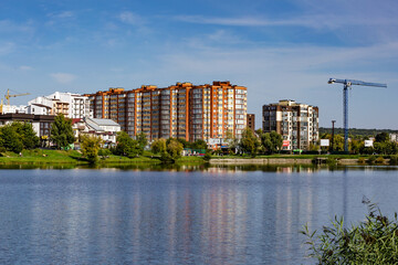 Fototapeta premium Khmelnytskyi. Ukraine.Beautiful view of the city from the bank of the Southern Bug River. Autumn sunset.