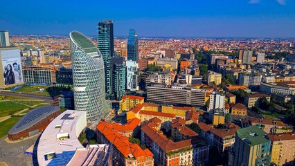 Aerial view of modern stylish cityscape of business skyscrapers. unicredit tower and UnipolSai, Microsoft Italia. Skyline. Drone. Sunny day and blue sky. Fashion city. Europe Italy Milan 01.2024