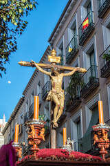 Image of Christ processioning through a street in Madrid during Holy Week