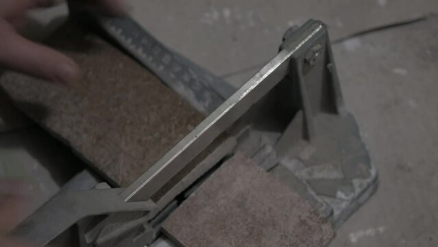 utting ceramic tile with manual tool for home renovation