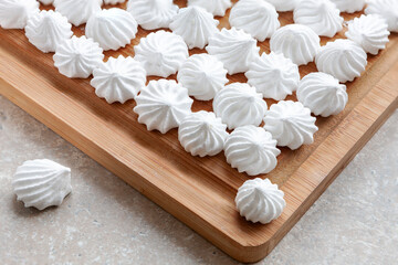 White  Meringues on the wooden tray