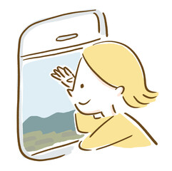 電車の車窓から景色を眺める女性旅行者