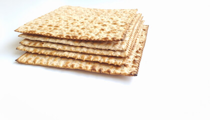 Matza, a traditional Passover food on a light background. close up
on a white background
with free space for text

