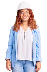 Young latin woman wearing architect hardhat with a happy and cool smile on face. lucky person.