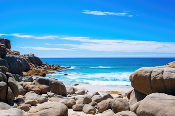 A scenic rocky beach with crystal blue water and various sized rocks scattered along the shore, Big rocks on the ocean landscape beach view with a blue sky, AI Generated