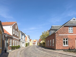 Fototapeta na wymiar Wanderlust in street Ribe city, , Ribe is a town in Esbjerg municipality in Region Southern Denmark