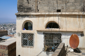 A house whose windows were destroyed due to the continuous bombing of the city of Taiz, Yemen