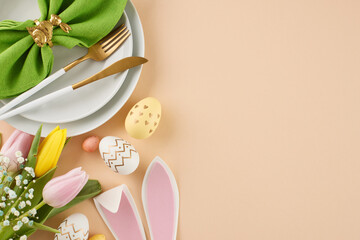 A delightful Easter affair. Top view photo of plates, cutlery, green napkin in rabbit shaped ring,...