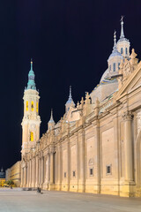Fototapeta na wymiar Basilica of Our Lady of the Pillar illuminated at night, Zaragoza, Spain. High quality photo