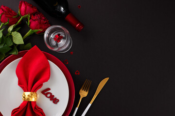 Refined Valentine's Day dining soiree. Top view photo of plates, cutlery, hearts, red roses, wine bottle, wine glass on black background with empty space for greeting banner