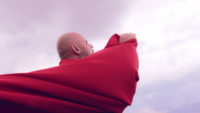 A monk in red prays in the steppe. A divine ritual.