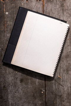 Blank notebook with grid pages
