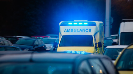 Fast moving ambulance car of emergency medical service on busy city street. Themes health care,...