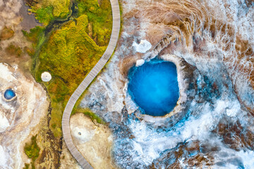 Elevated view over the geothermal blue pool Blahver at Hveravellir geothermal region in the highlands of Iceland. Hveravellir geothermal hot spring area in a volcanic landscape, Iceland
