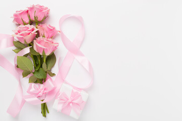 Composition with pink roses, gift box and eight made of ribbon on color background, top view. Women's day concept