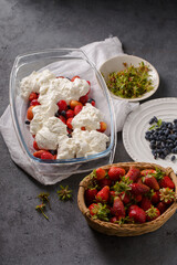Milk dessert with strawberries and honeysuckle