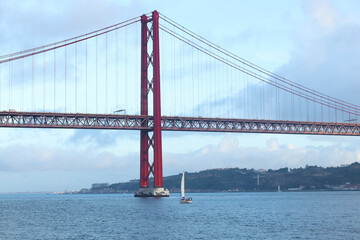 View of 25th of April Bridge in Lisbon, Portugal. Tagus river.