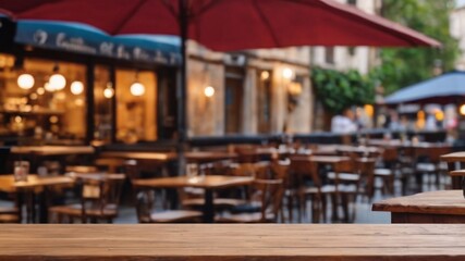 Empty wooden table with a blurred cafe terrace in the background, inviting and ideal for product display