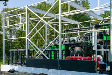 New modern unfinished wood chip biofuel boiler house for increased heat energy production efficiency