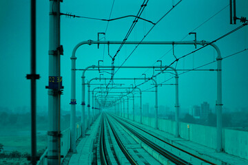 Abstract perspective of Dhaka Metro Rail tracks showcasing the sleek and modern infrastructure, illustrating the backbone of urban connectivity in Dhaka, Bangladesh.