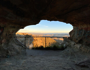 View through a rock cavern. Sunset over the blue mountains, Sydney, Australia, NSW. Spectacular...