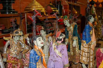Fototapeta na wymiar colorful traditional buddhist decorated marionettes with jewelry