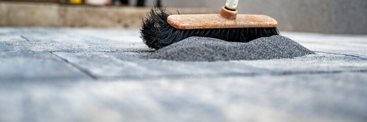 Brushing sand in cement tile gaps