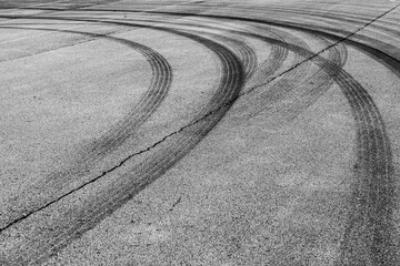 Black tire marks on the asphalt.