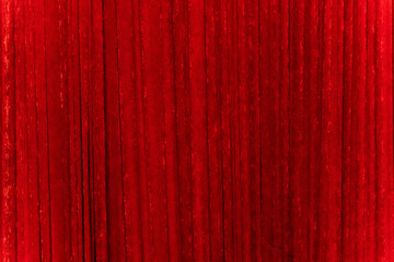 A curtain made of red plush fabric covering the stage.