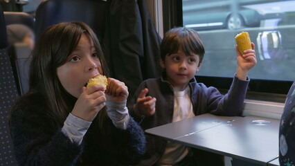 Siblings Snacking Corn in Moving Train - Brother and Sister Enjoying Healthy Food