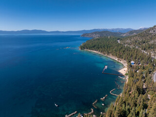 Fototapeta na wymiar Beautiful aerial view of the Tahoe lake from above in California, USA. Wild forests, fresh air and mountains of California.
