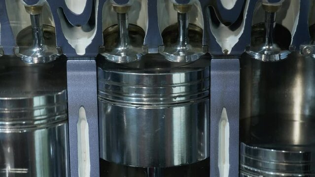 Close up showing work of pistons and structure of car engine inside. Principle of operation of transport mechanism. Machine structure demonstration. High quality 4k footage