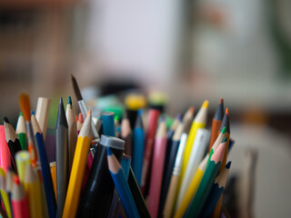 children's pencils and markers in a box